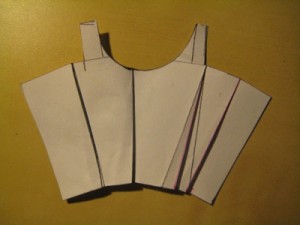 IMG_3262 Fully folded out, a block that has been adjusted for a large bust looks a little less jarring. (The fact that we've now got a curved top edge goes a long way towards explaining why extreme boobs and doublets aren't such good friends!)
